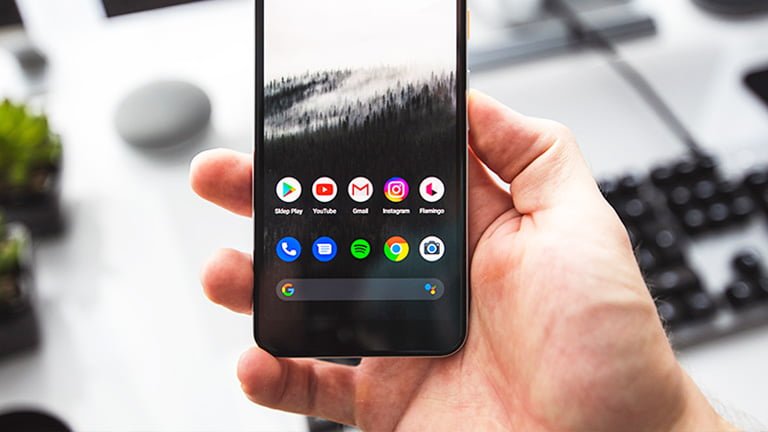 A hand holding Pixel 6 eSIM phone that supports Google Pixel 6 dual SIM