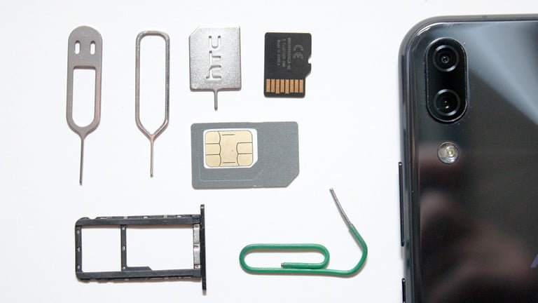 Various tools like pins and clips to take SIM card out from smartphone