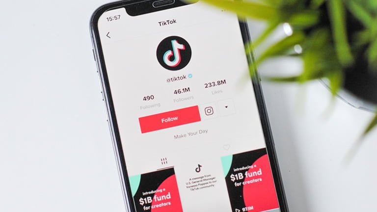 An iPhone showing TikTok official channel on TikTok