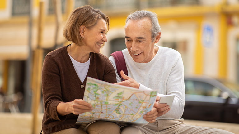 An-old-couple-traveler-is-finding-map-easily-with-esim-usa-prepaid